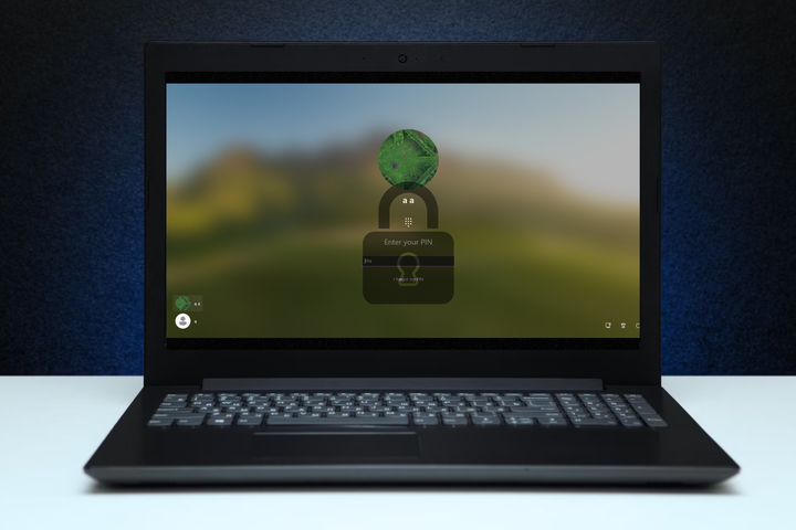 A windows laptop with the logon screen and a lock icon
