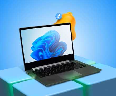 Laptop on a 3D Windows logo with notification bell icon in background