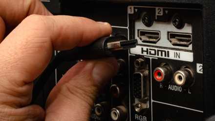 hdmi cable inserting into back of tv hdmi port