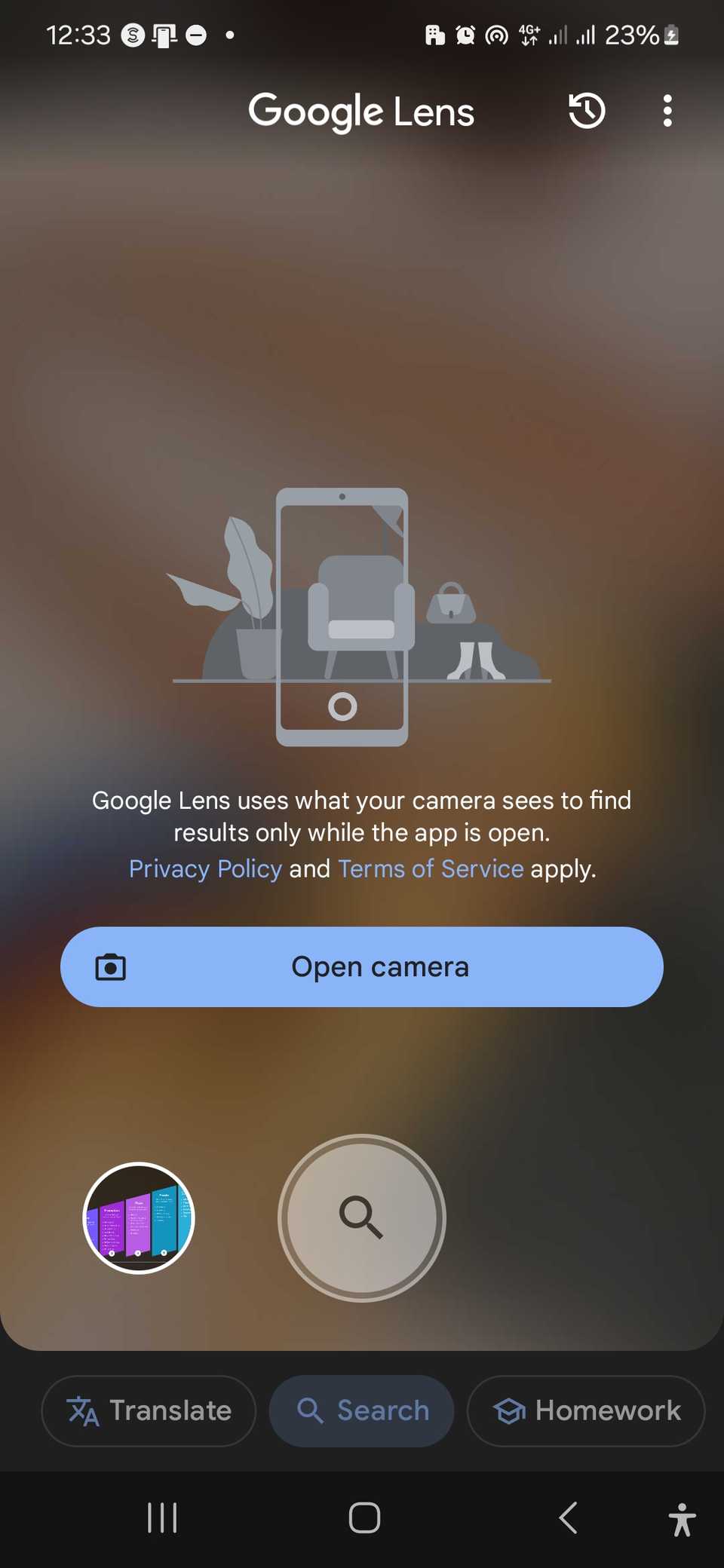 The Google Lens app open on a Galaxy S22 requesting camera permissions