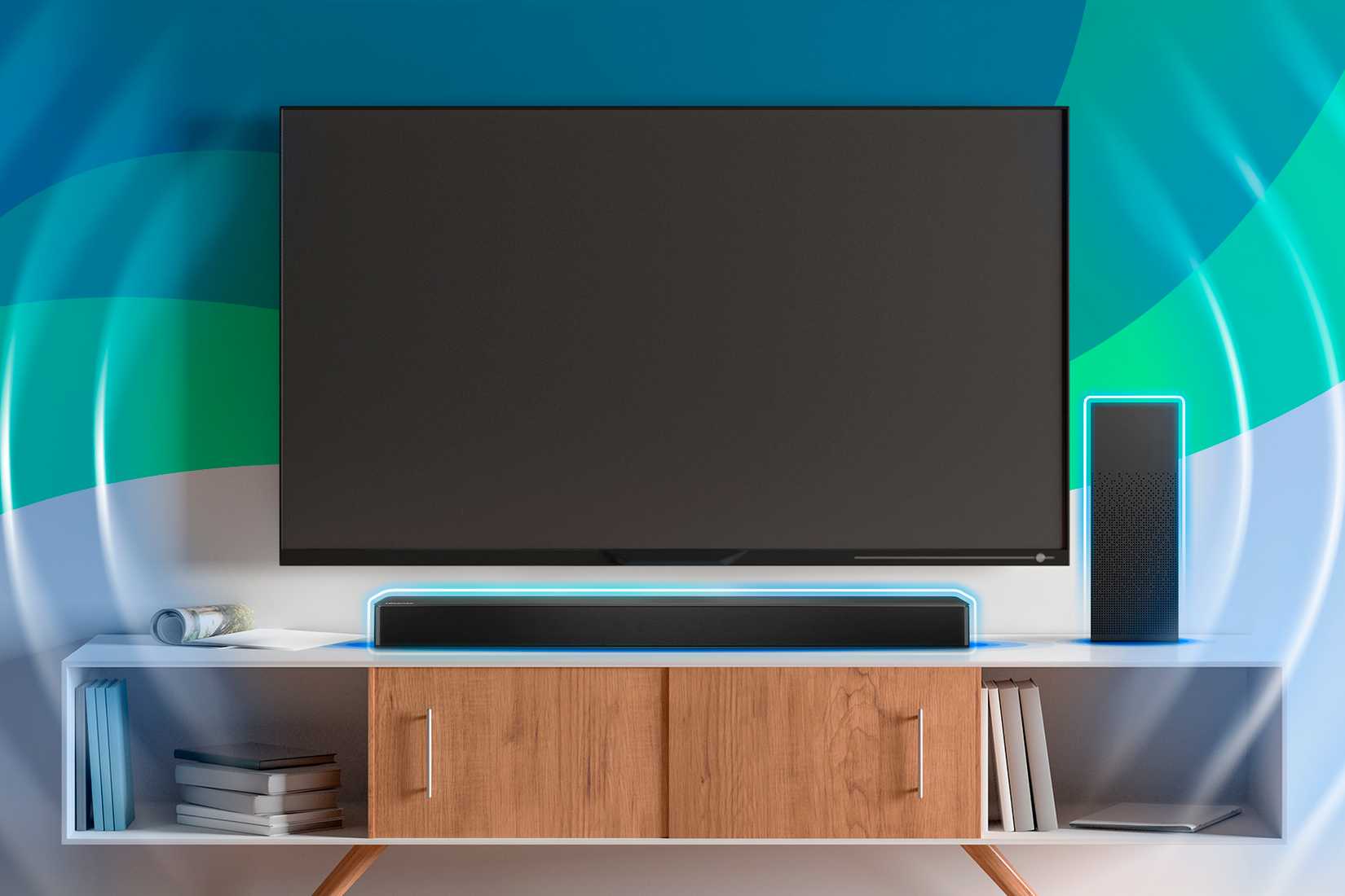 A TV on the wall with a soundbar on the shelf.