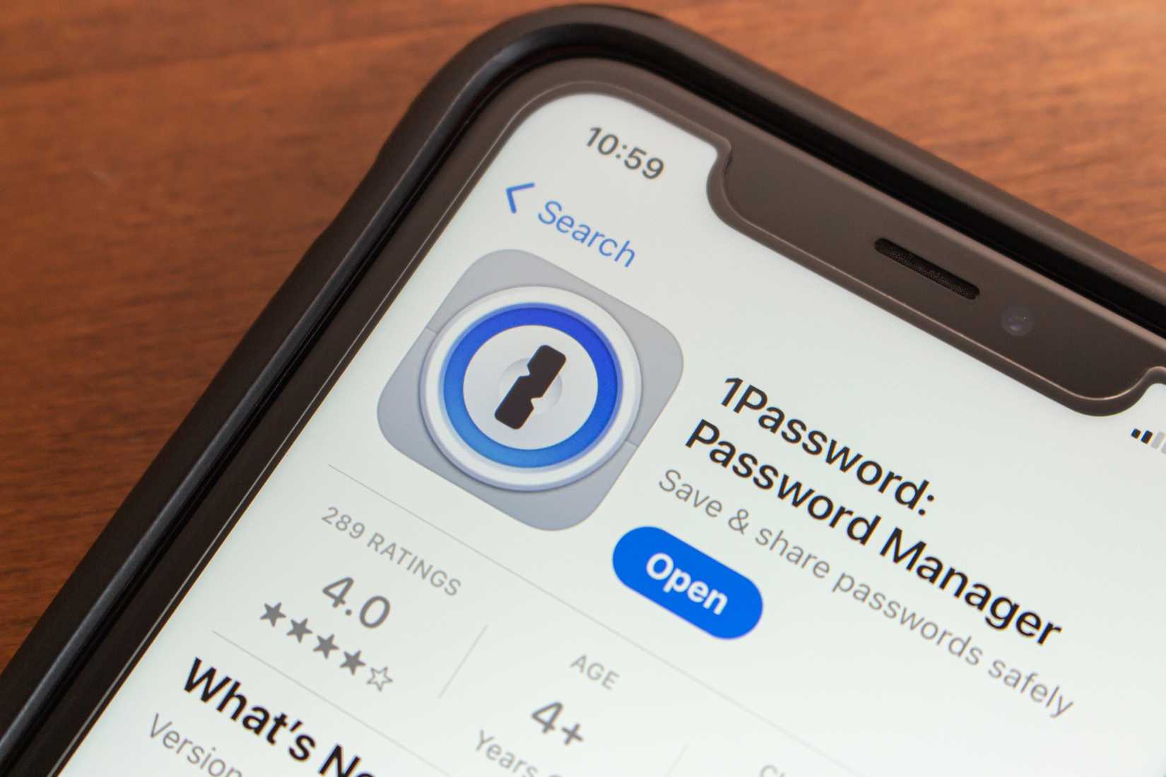 1password app store listing on smartphone screen.