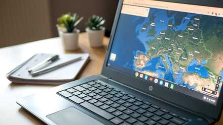 hp chromebook on table showing google maps.