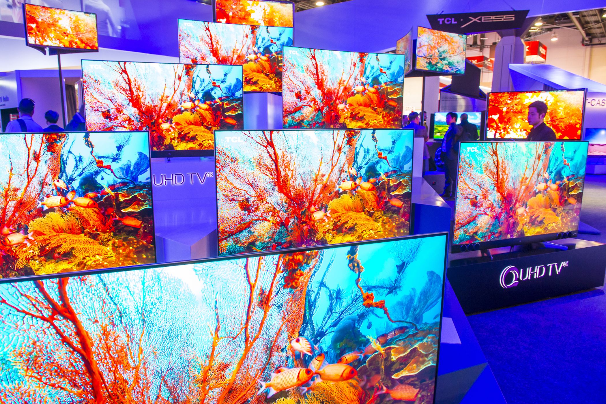 qled tvs on display at tech show.