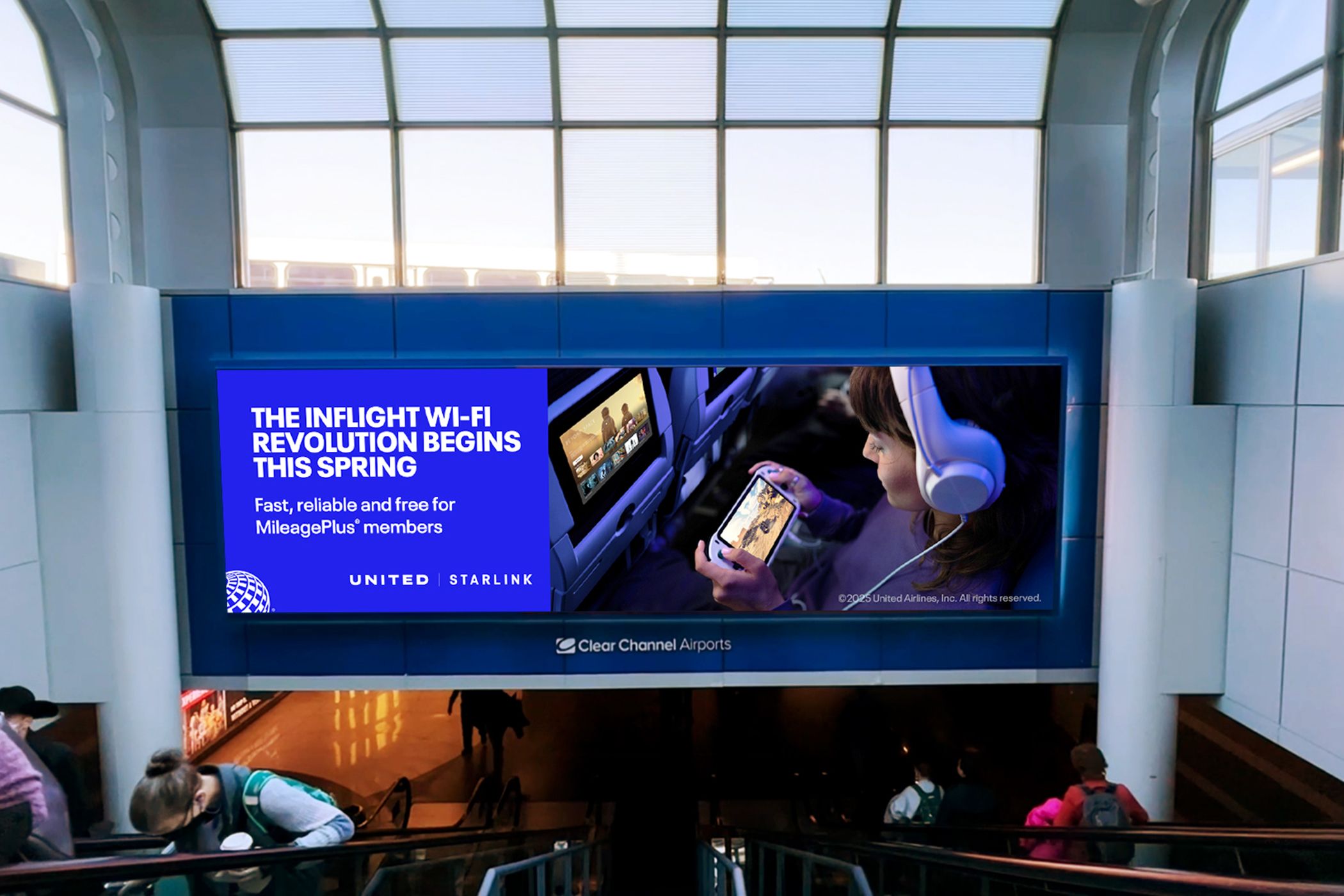 A billboard for United, showing a collaboration with Starlink for better in-flight Wi-Fi