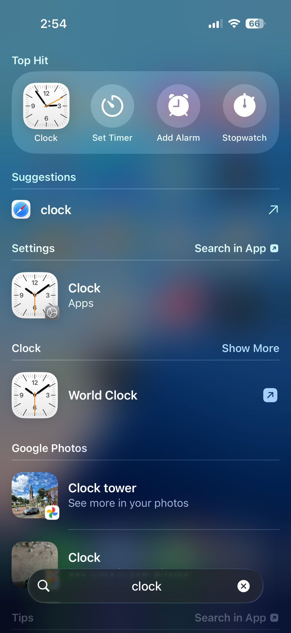 iPhone Spotlight menu showing search result of Clock