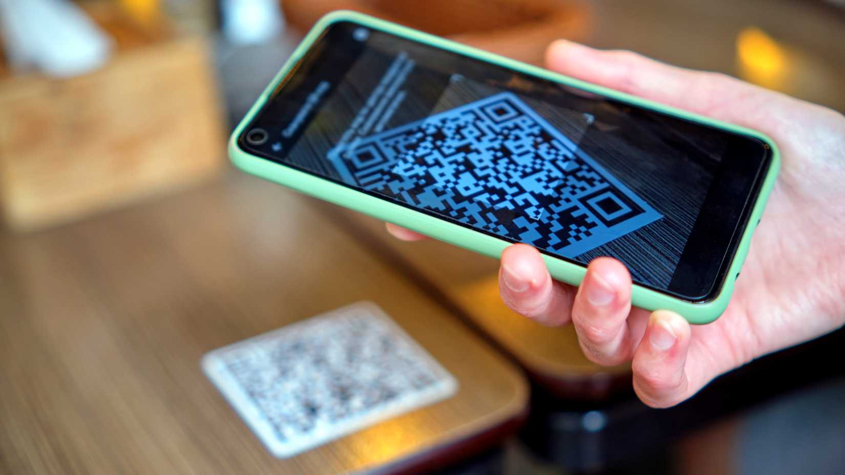 scanning cafe qr code menu with smartphone.