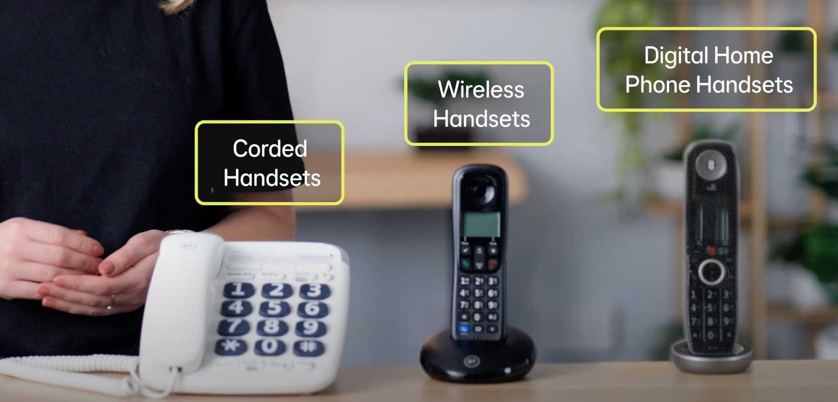 landline phones in row on table.