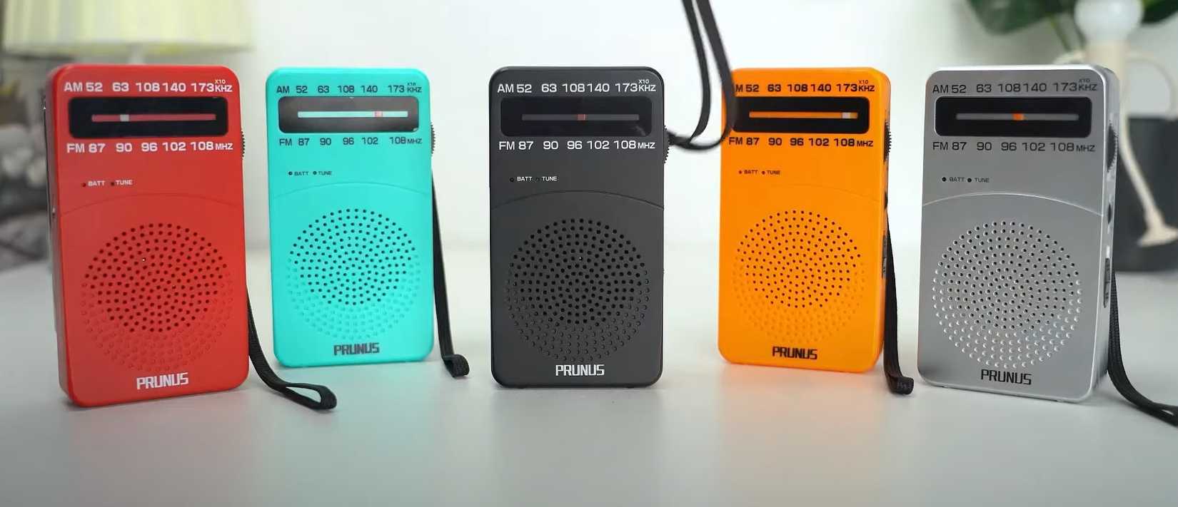 portable radio in a line on a table