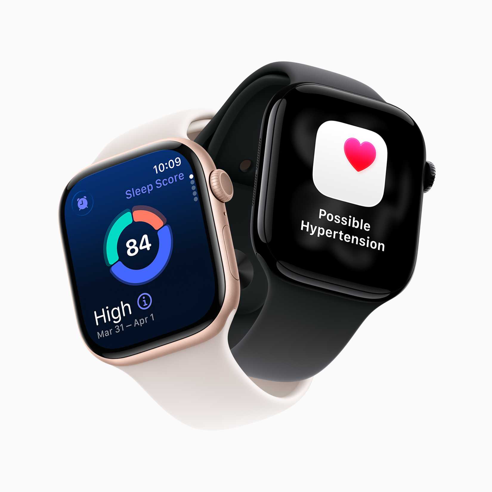 Two floating Apple Watch Series 11 models. One has a white wristband and is displaying the pie-chart styled sleep score icon with an "84" in the middle. Another has a black wristband and has the white square icon of the Health app, which features a pink heart in the upper-right corner.