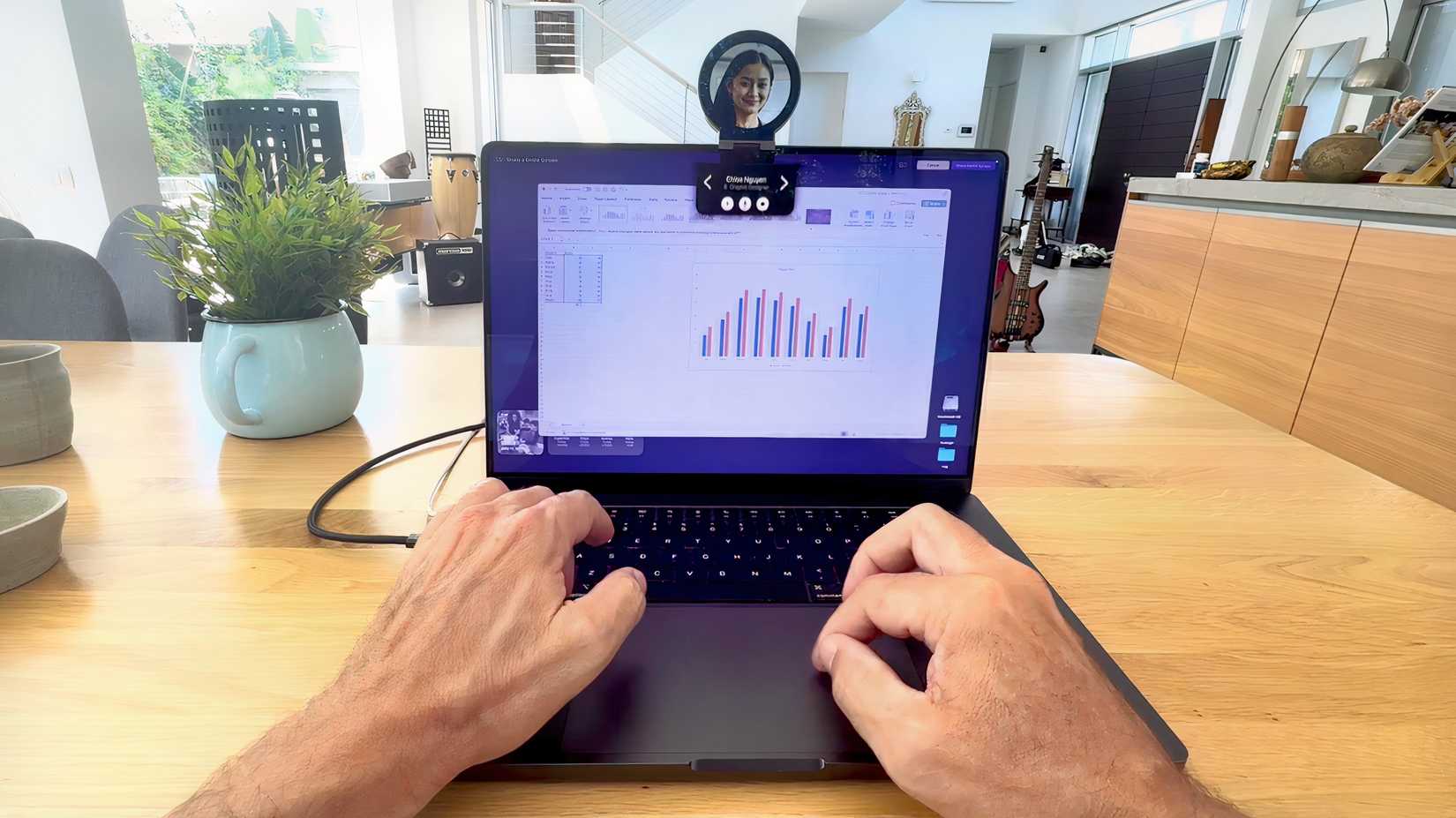 Napster AI in use with the Napster View device resting on the laptop screen