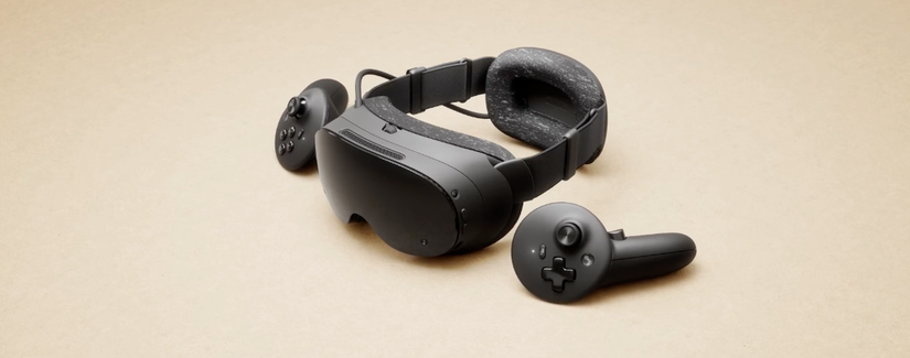 The Valve Steam Frame headset and two controllers sitting on a beige background