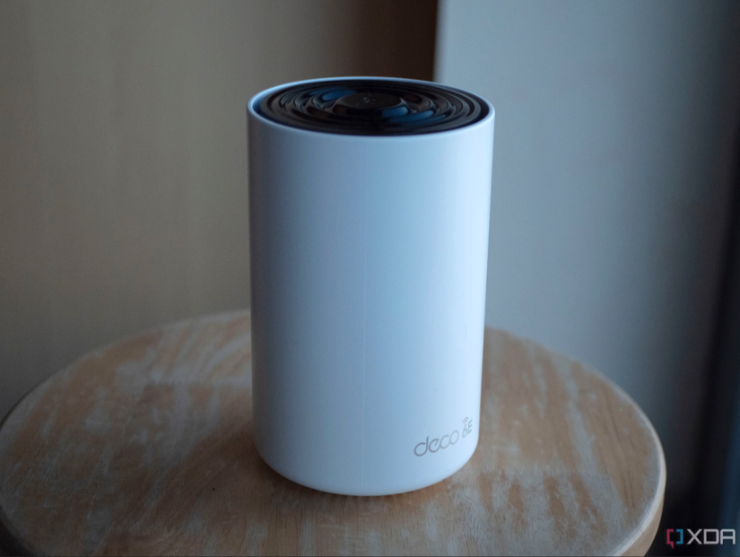 tp link deco xe75 router on stool.