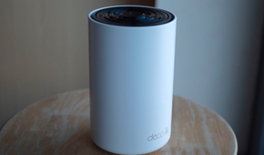 tp link deco xe75 router on stool.
