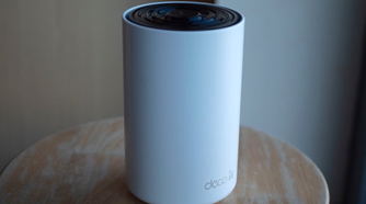 tp link deco xe75 router on stool.