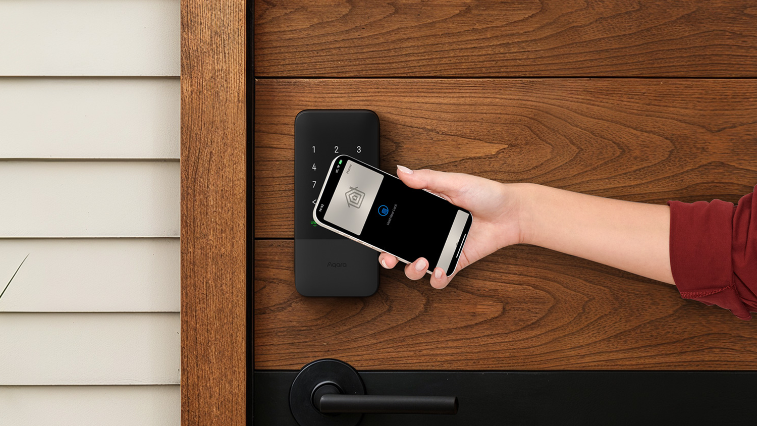 Person unlocking the Aqara Smart Lock U400 with their phone.