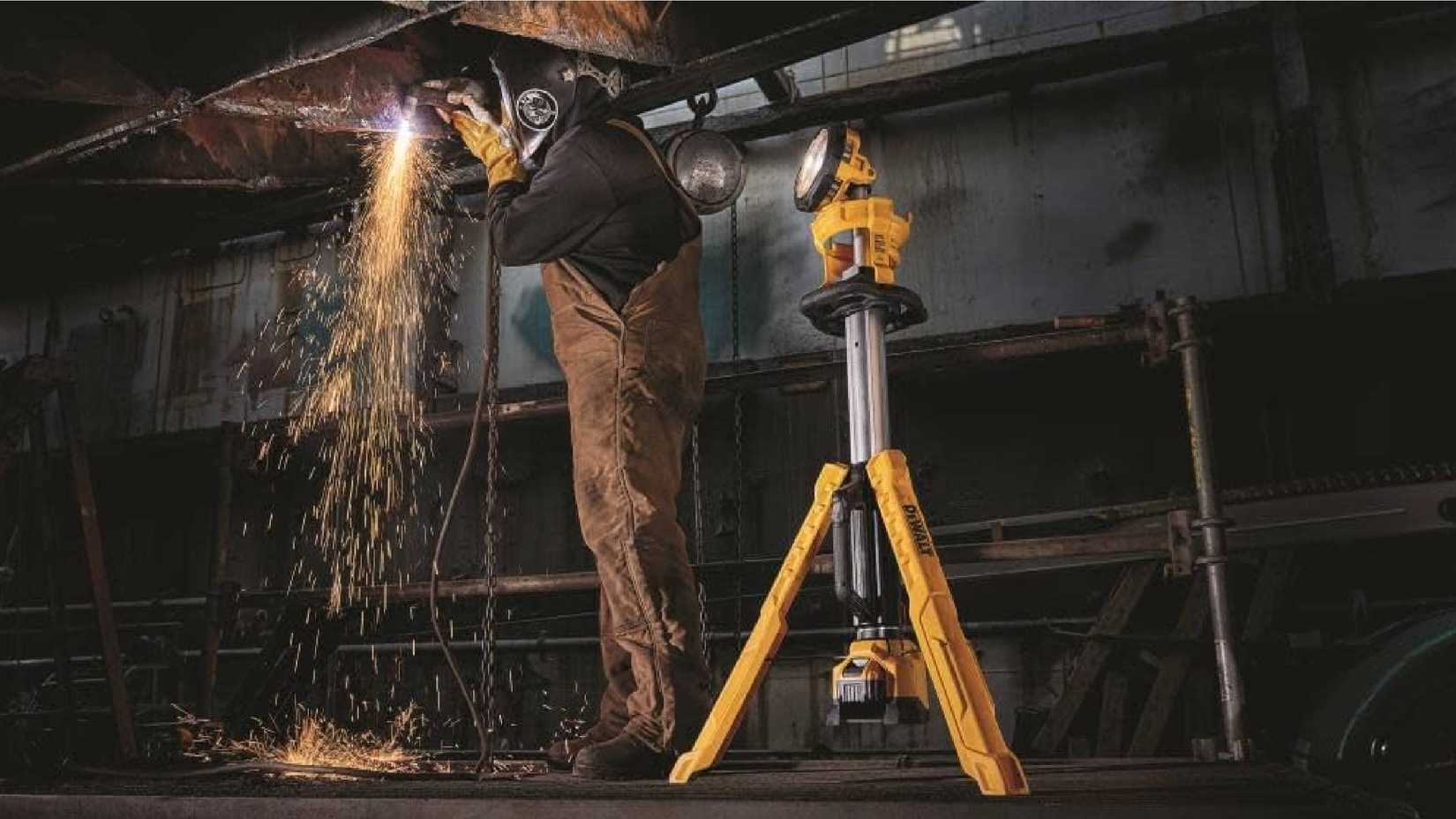 A DEWALT 20V MAX LED Work Light with Stand being used