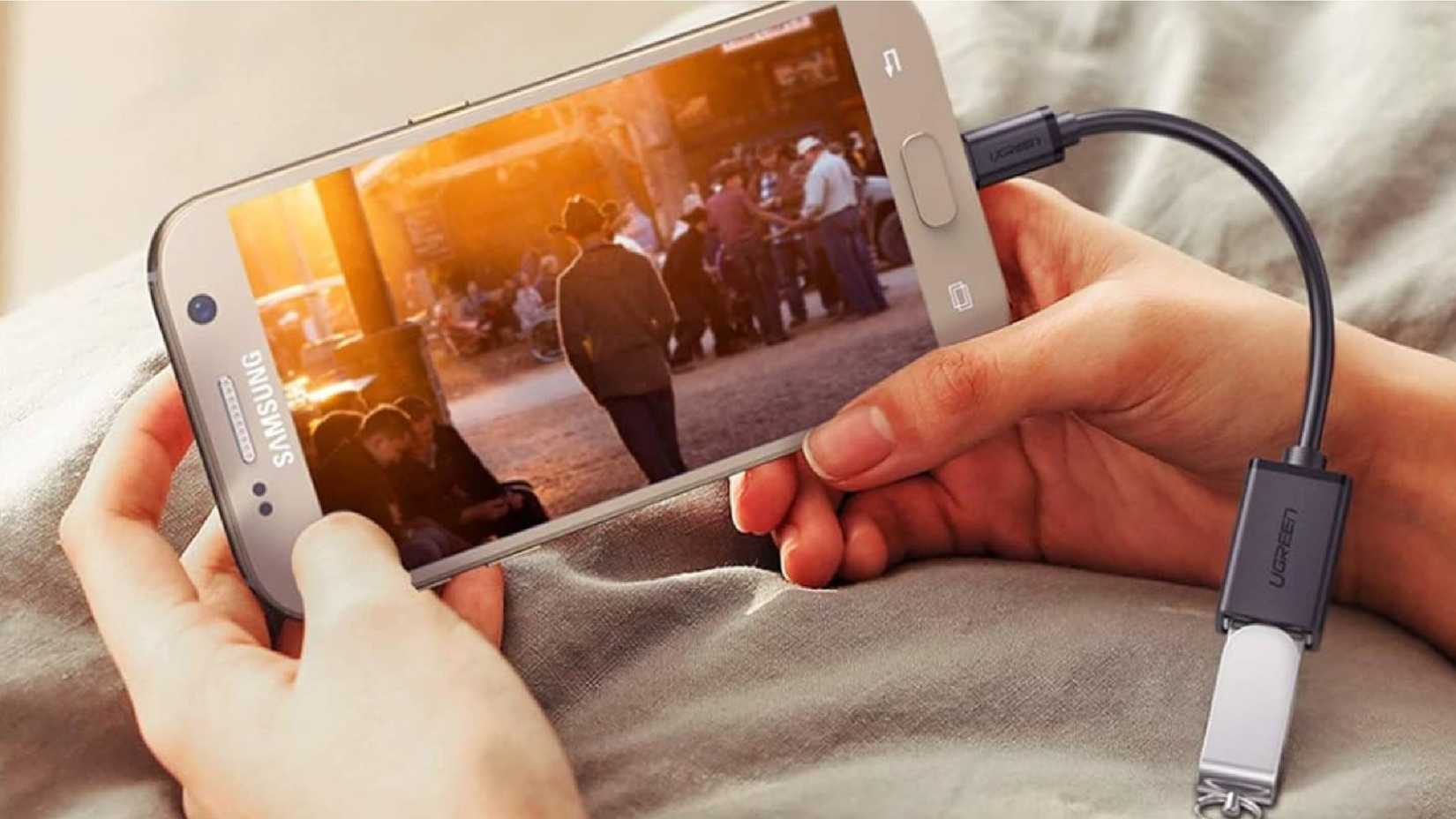 UGREEN Micro USB OTG adapter with a phone