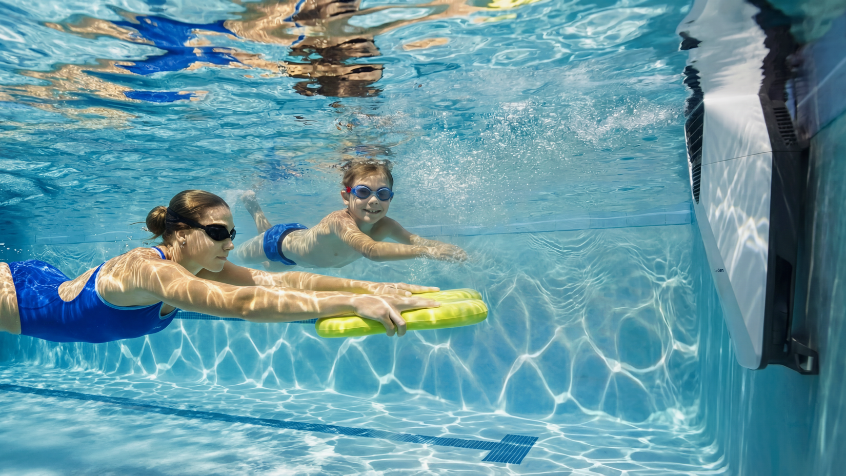 Swimmers swimming against the current of the iGarden Swim Jet X Series.