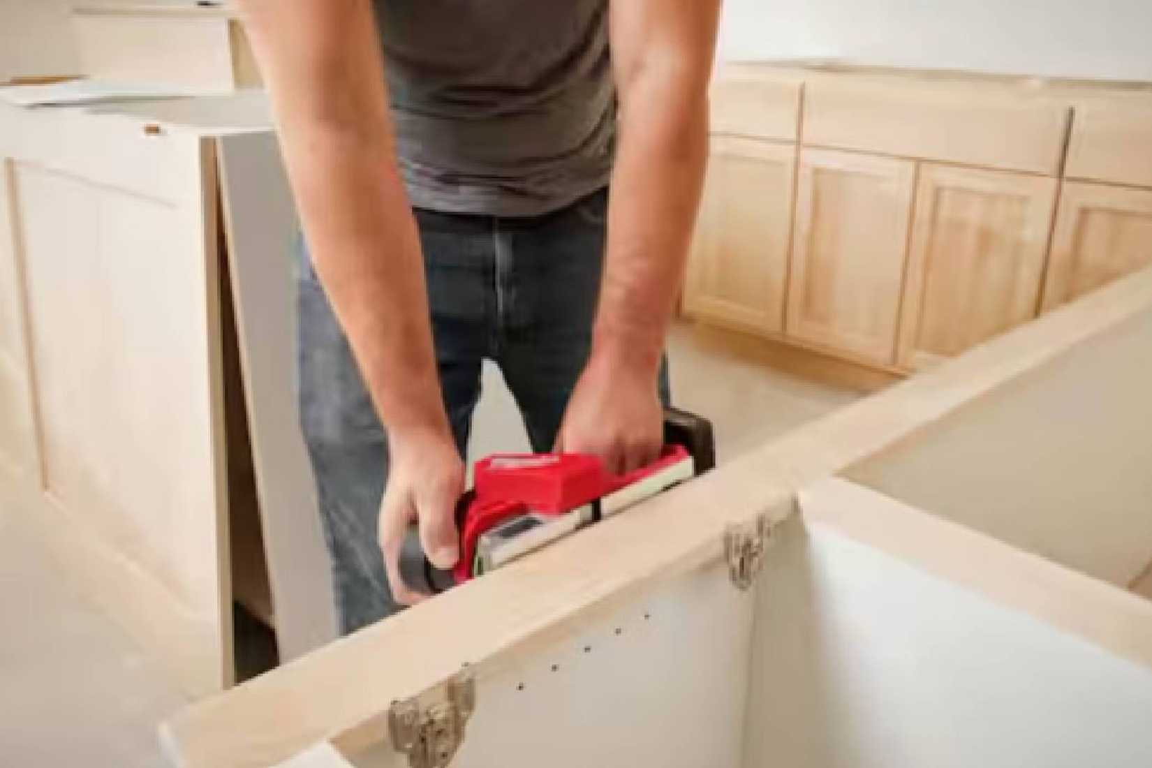 A M12 12V Lithium Ion Brushless Cordless 2 inch. Being used on a planar cabinet.