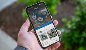 Person holding the Google Pixel 8a using Circle to Search