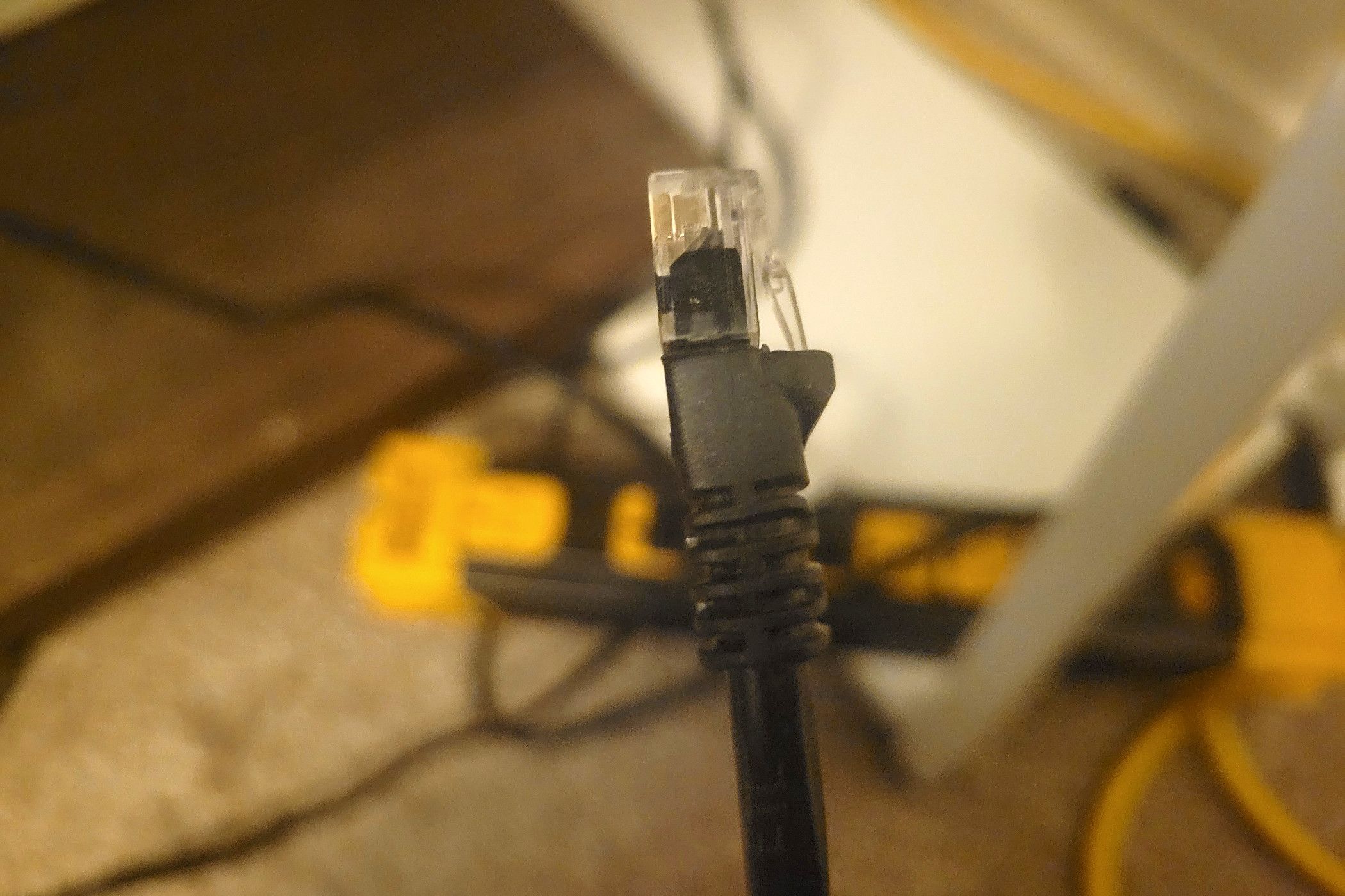 A good Ethernet cord in front of a power strip-1