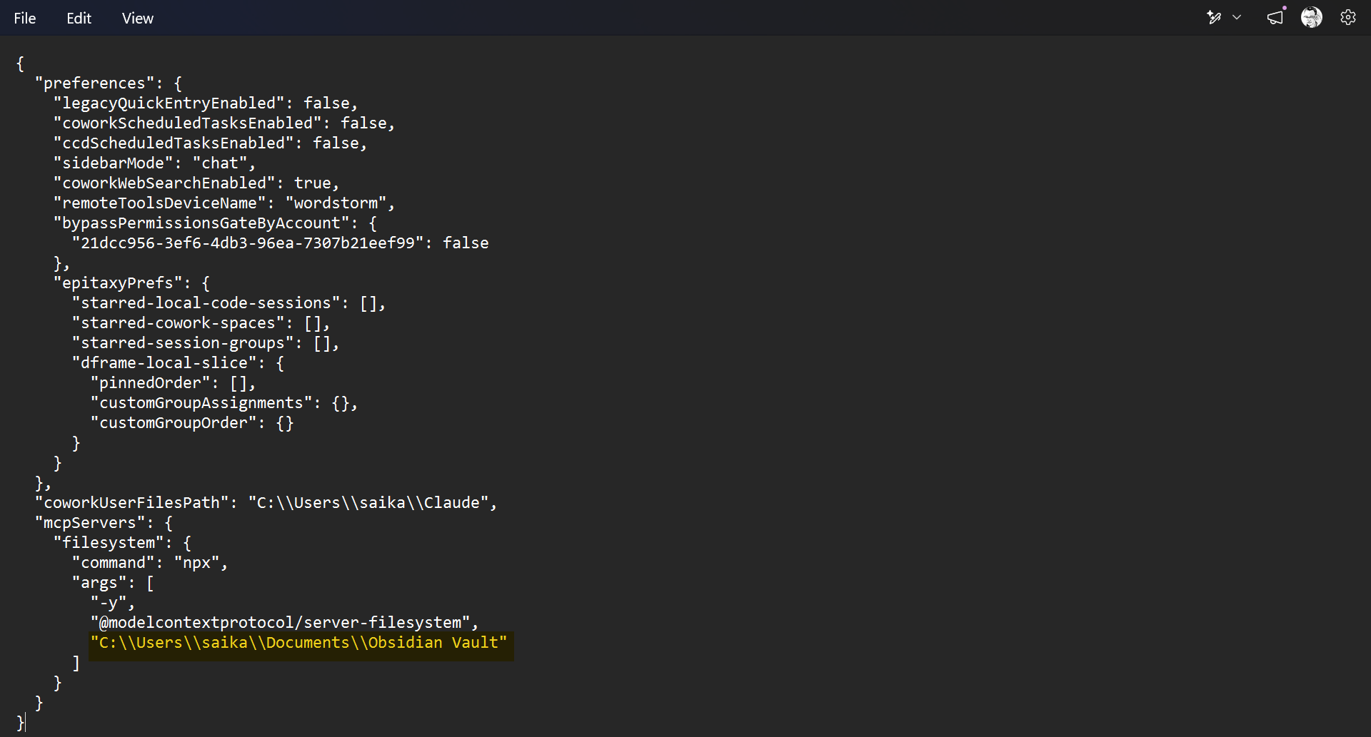 The claude_desktop_config.json file showing the Filesystem MCP server configured with an Obsidian vault path.