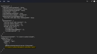 The claude_desktop_config.json file showing the Filesystem MCP server configured with an Obsidian vault path.
