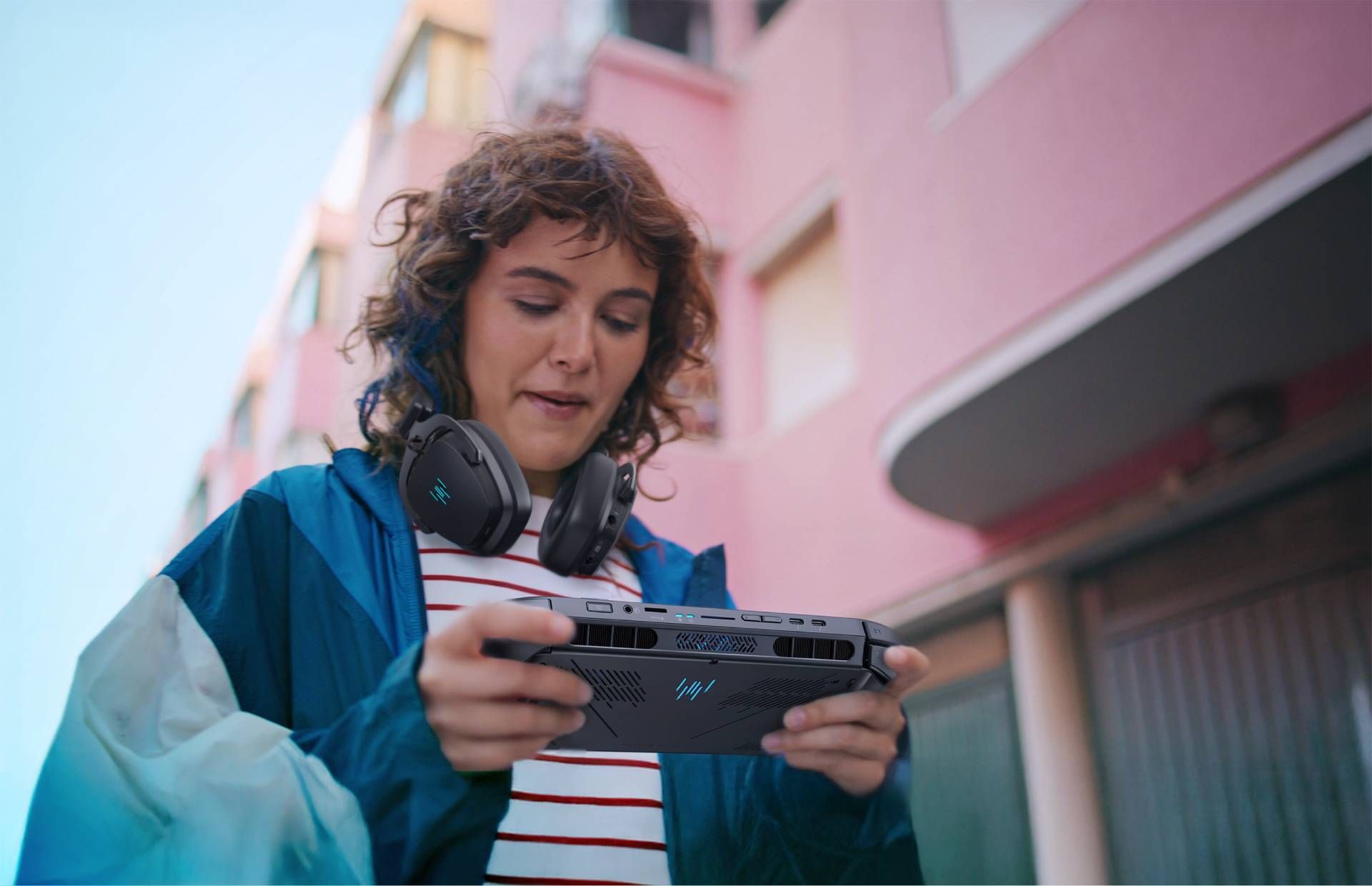 Woman using Acer Predator Atlas 8 walking down the sidewalk