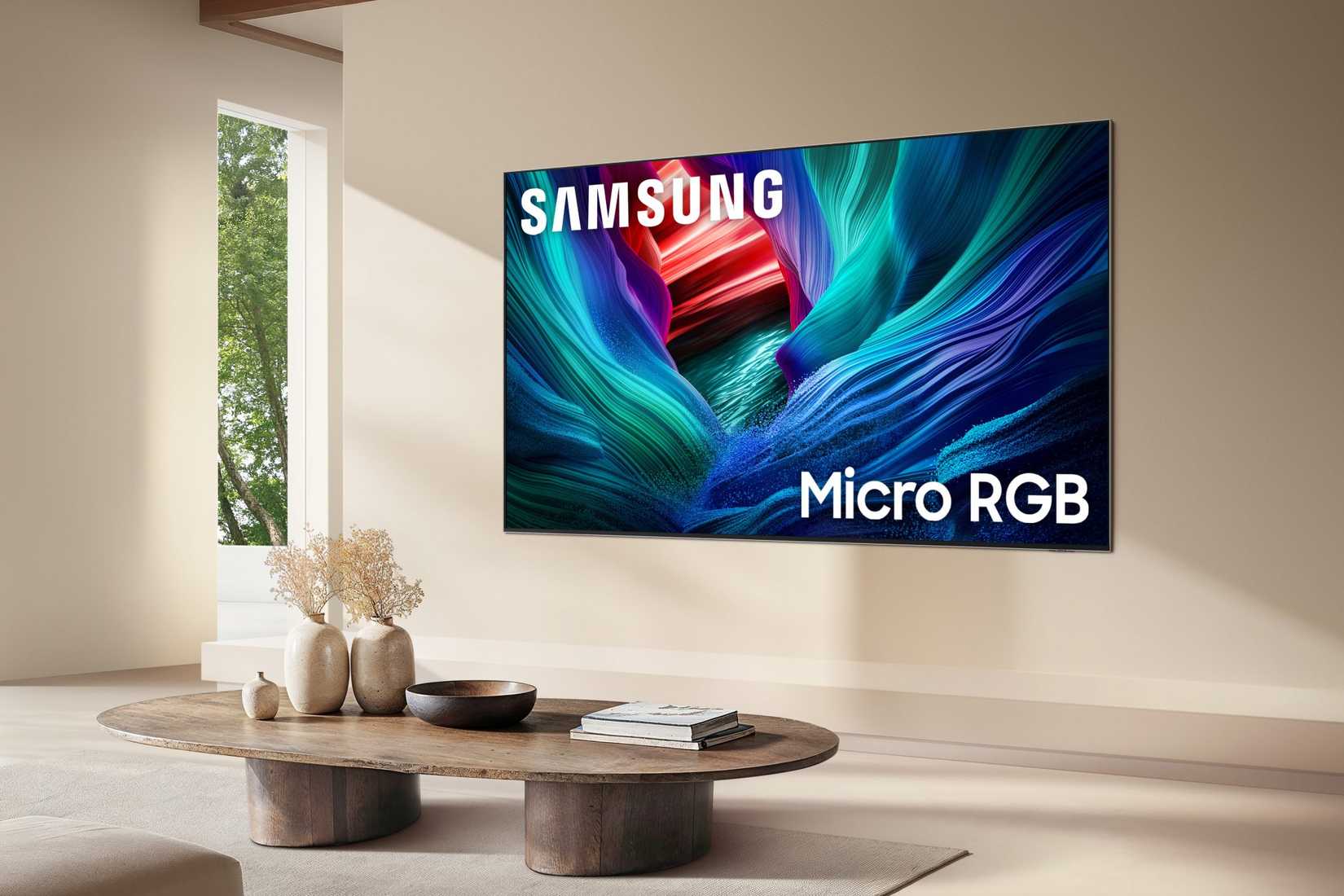 A Samsung Micro RGB TV hanging on a wall in a living room