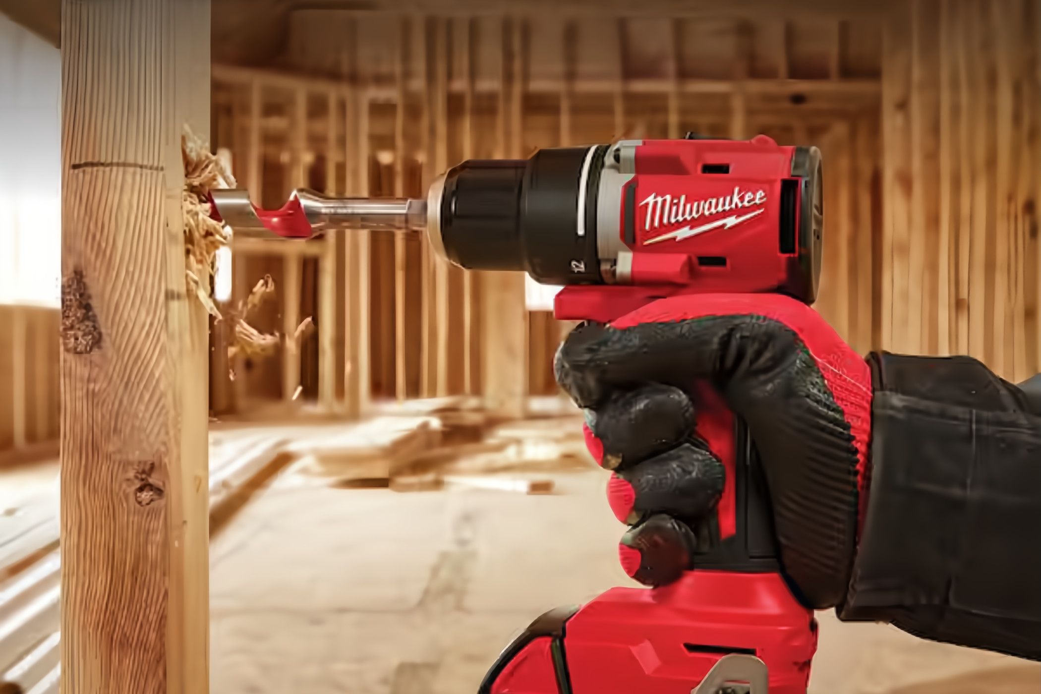 A person using a drill to drill in a hole