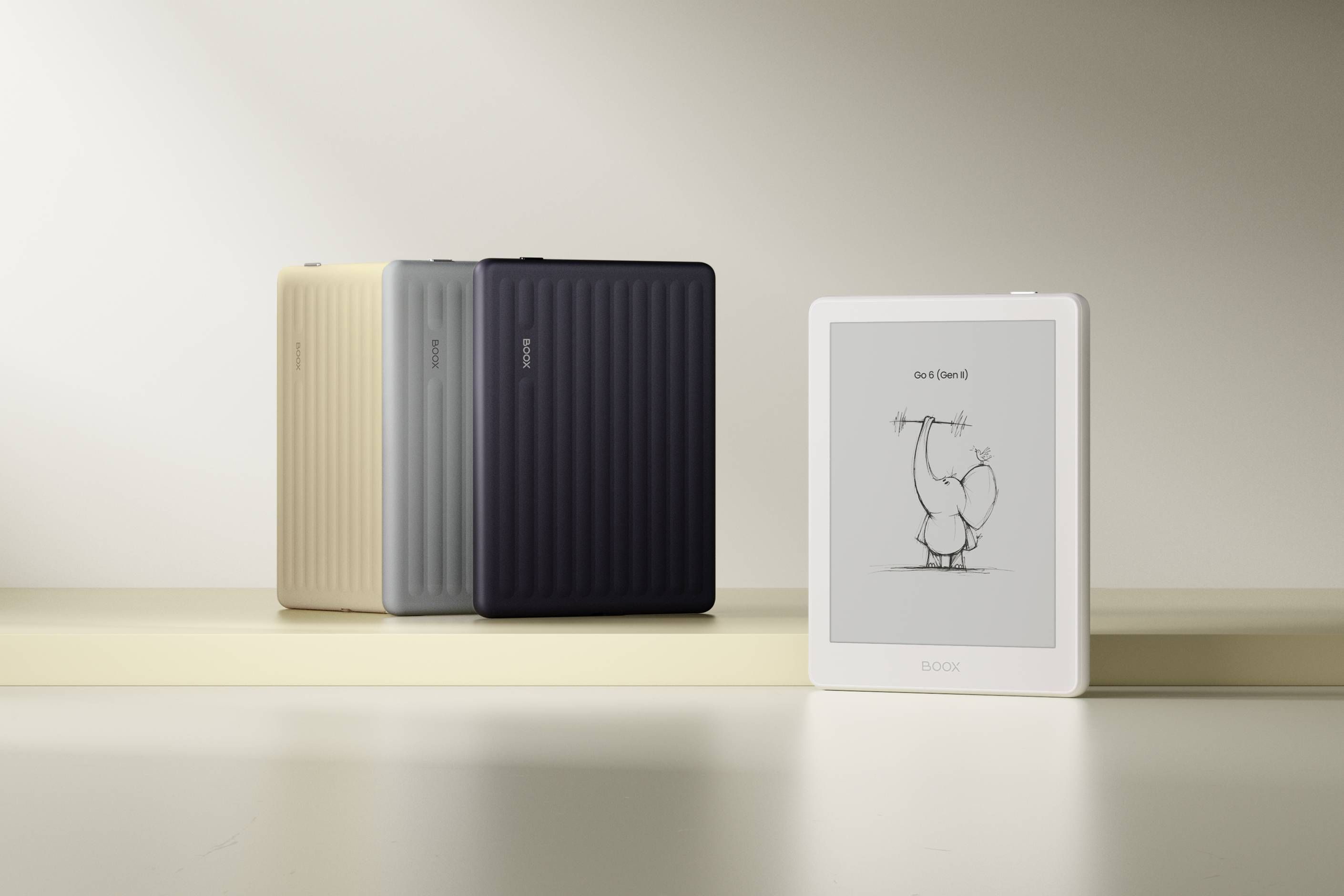 All colors of the Boox Go 6 Gen II lined up on a table in front of a wall