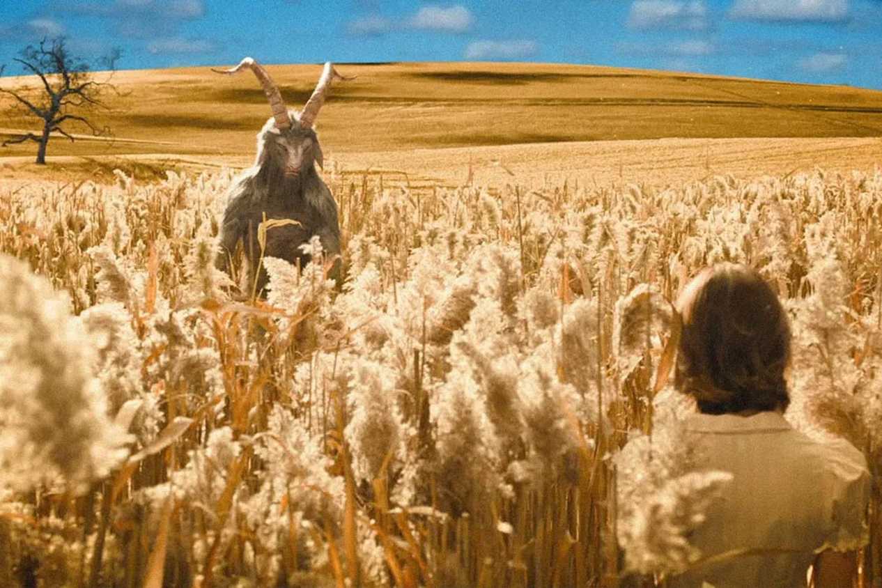 devil and woman in cornfield in Evil