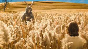 devil and woman in cornfield in Evil
