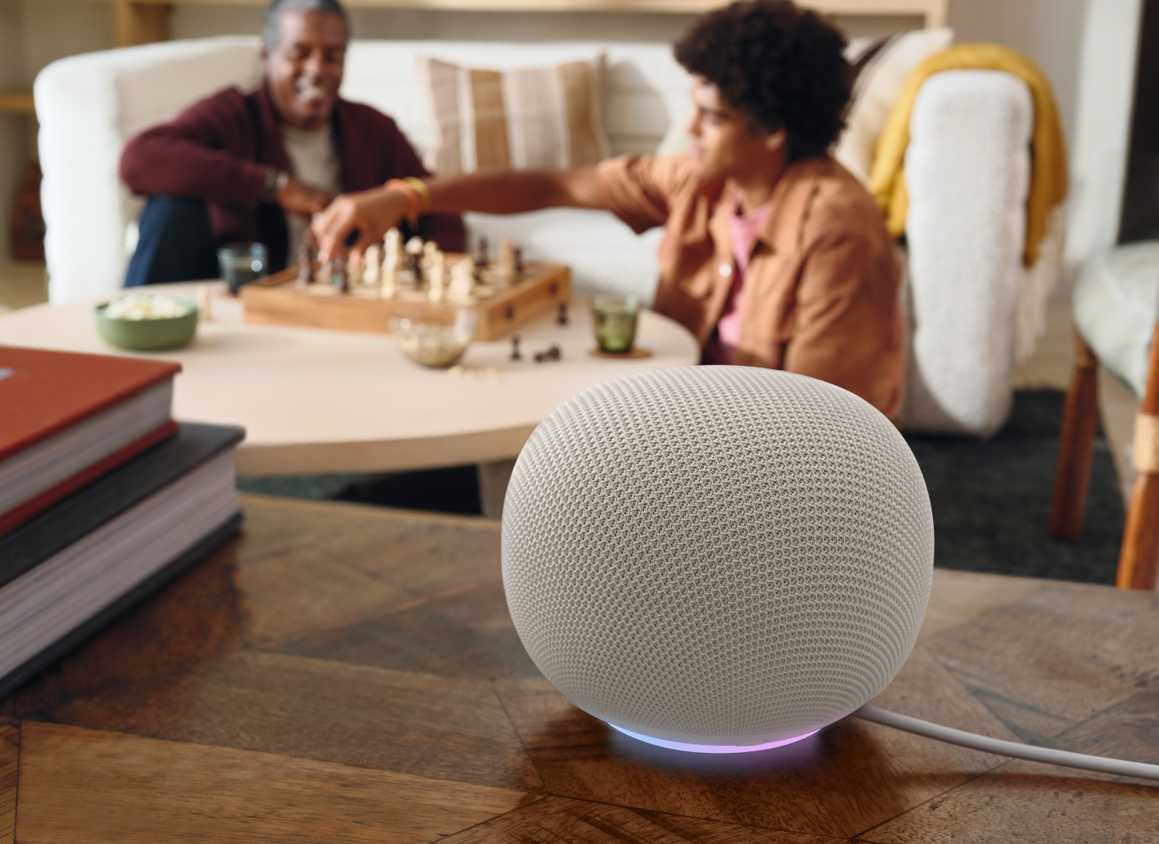 A Google Home Speaker in Porcelain sitting on a table.
