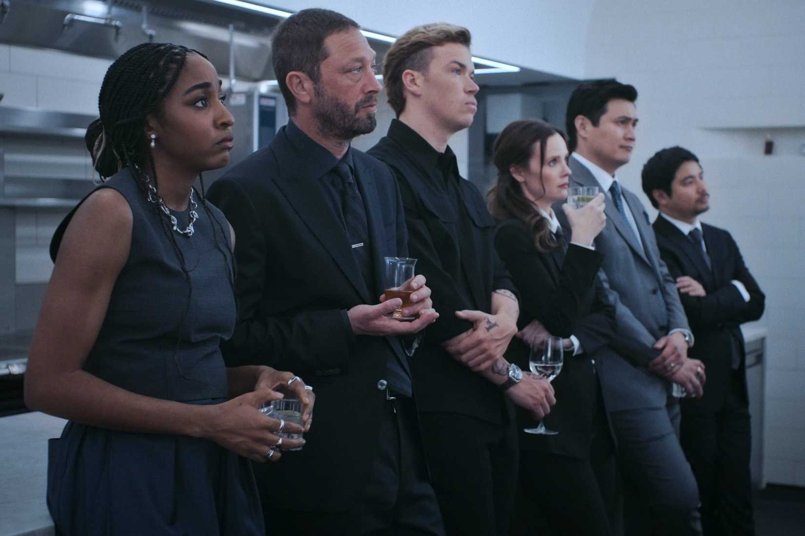 The staff standing in line in the back kitchen in The Bear.