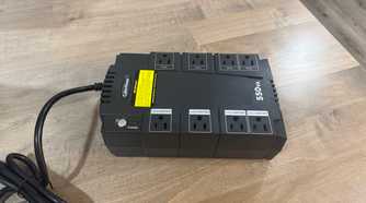 CyberPower 550VA UPS front angle view on wood desk