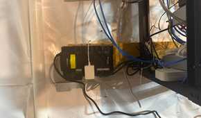 CyberPower 550VA UPS mounted near networking cables