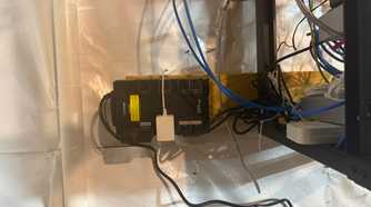 CyberPower 550VA UPS mounted near networking cables