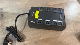 CyberPower 550VA UPS with coiled power cord on desk