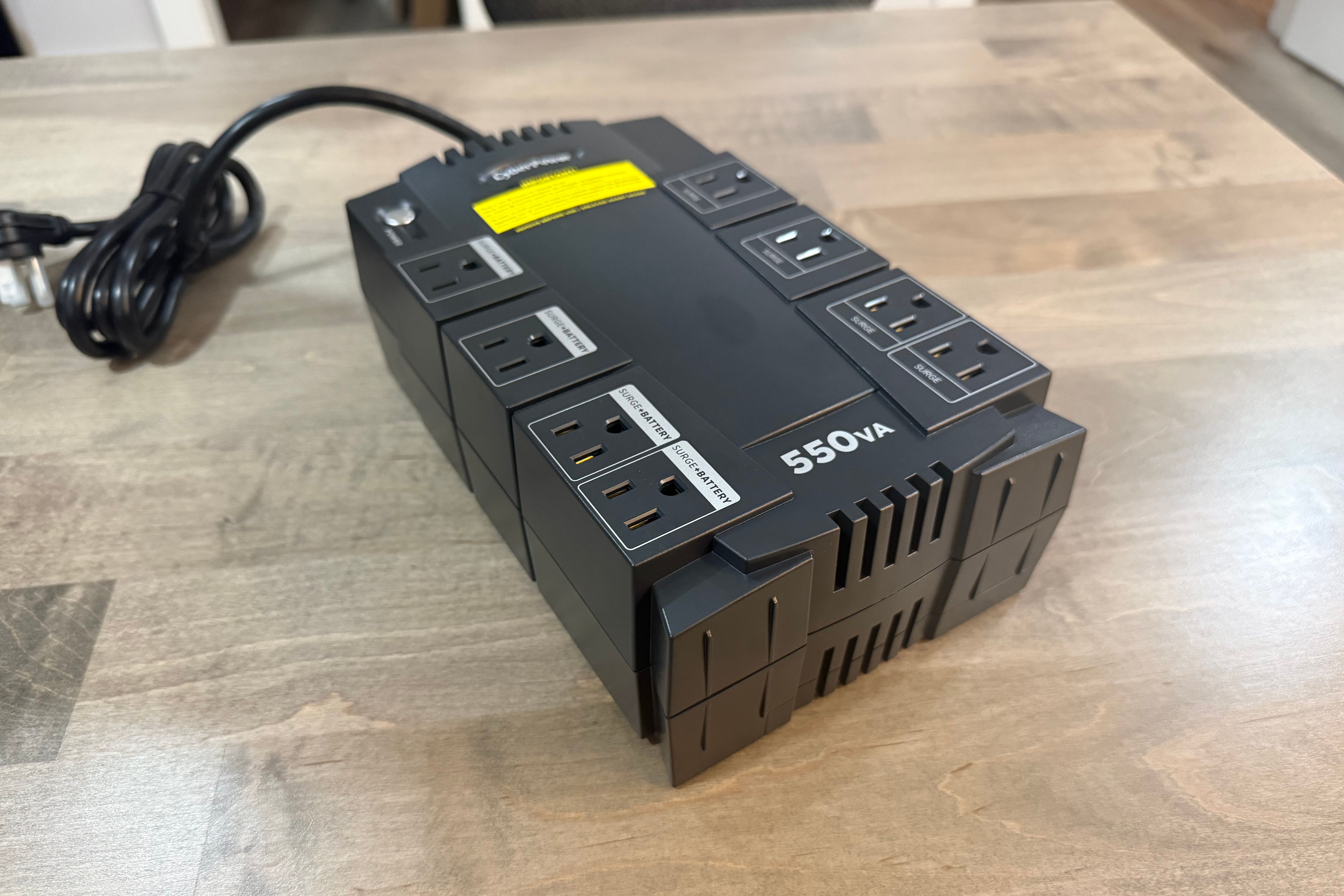 CyberPower CP550SLG UPS angled front view with coiled cord