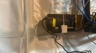 CyberPower UPS in utility area with device charging