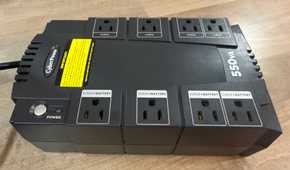 CyberPower UPS top view of eight outlets and power button