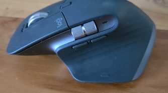 Gaming Mouse On Wooden Desk With Keyboard