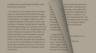 Kindle app page mid-turn showing the animated page flip effect.