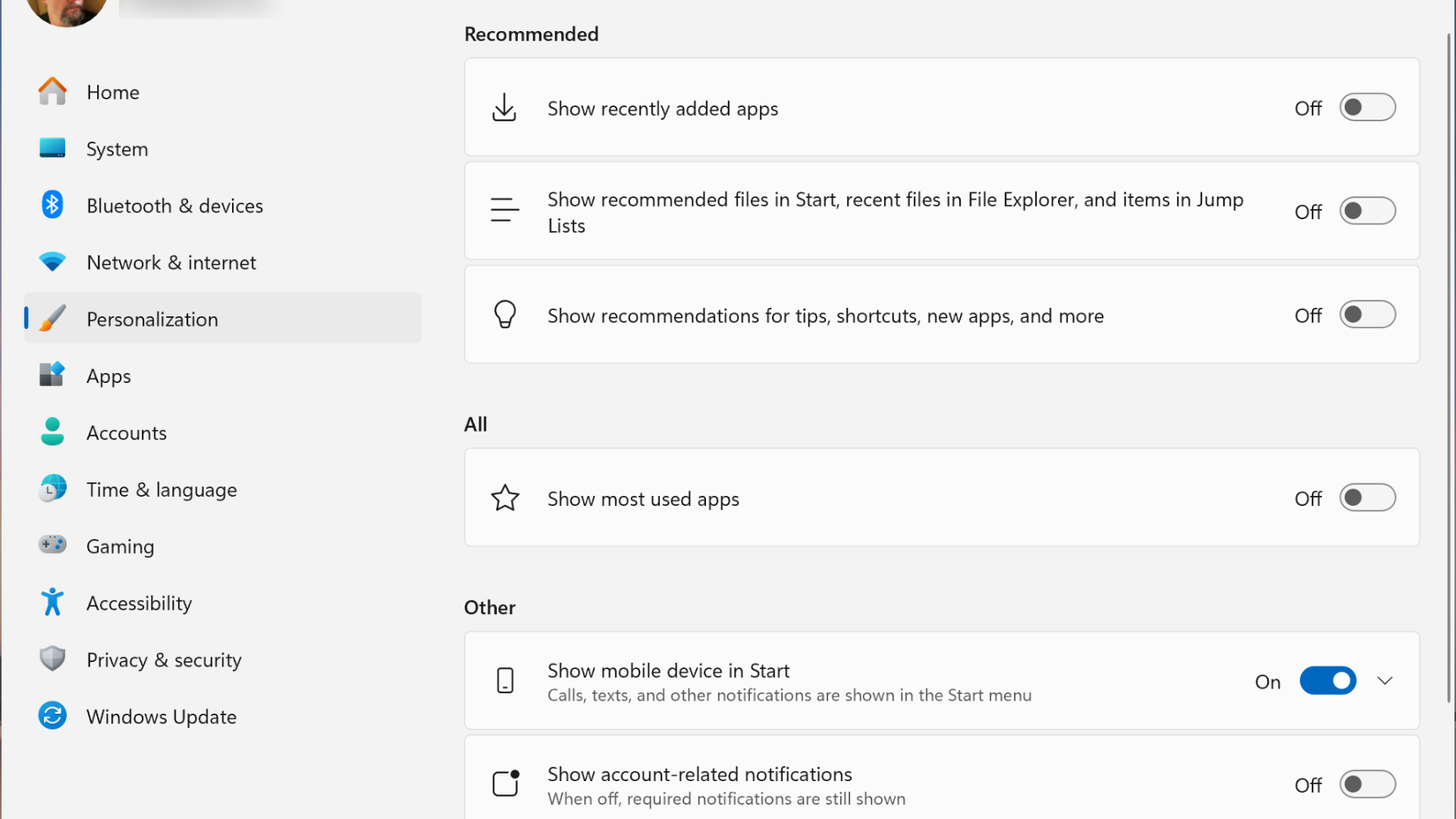 Windows 11 Start settings menu showing options to toggle recommendations, recently added apps, and mobile device integration.