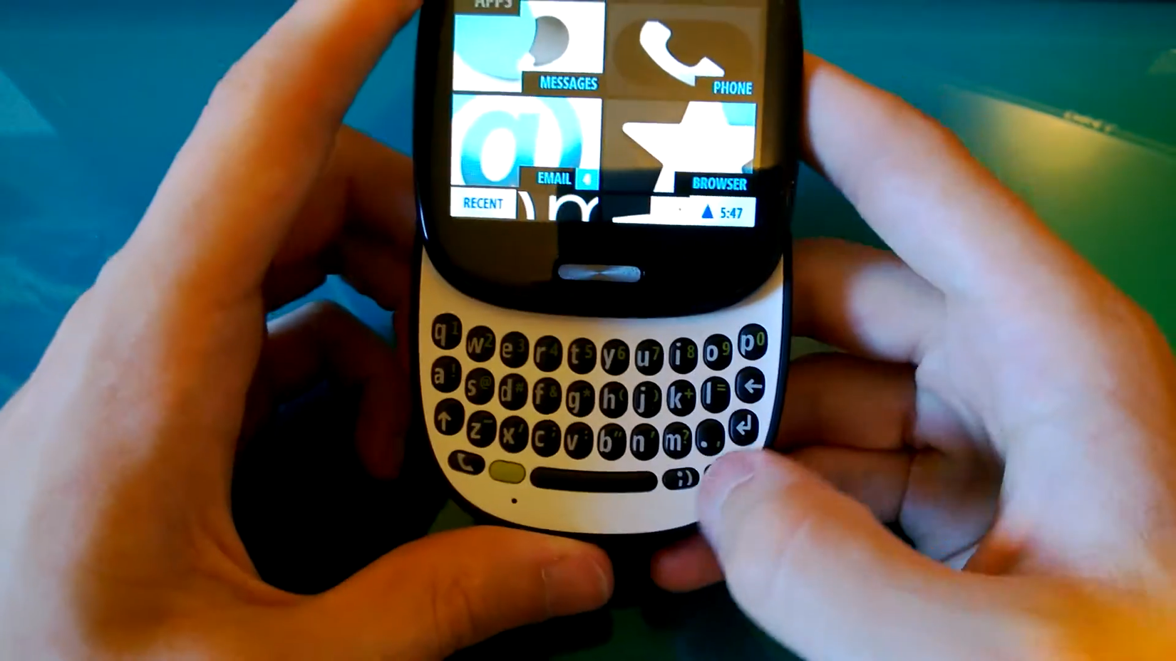 Person holding and using a Kin One phone.