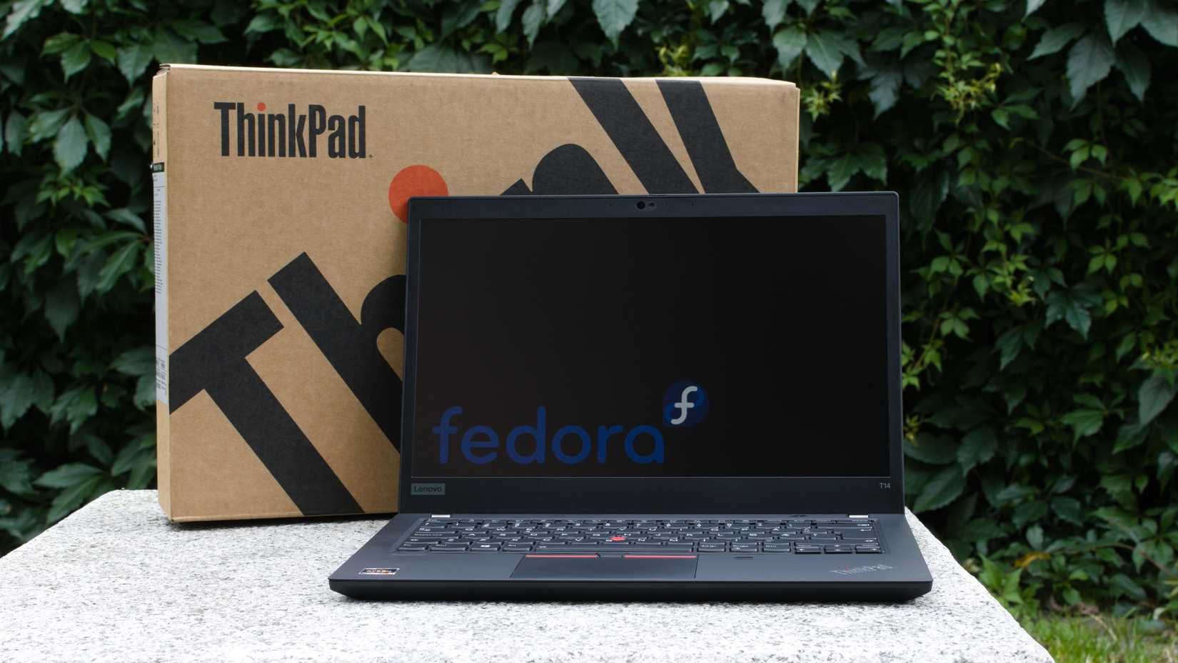 ThinkPad laptop with Fedora logo on screen
