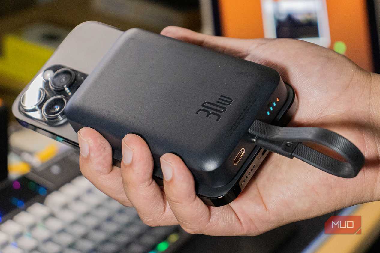 Baseus Magnetic Power Bank attached to an iPhone 14 Pro Max
