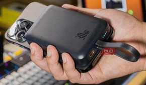 Baseus Magnetic Power Bank attached to an iPhone 14 Pro Max